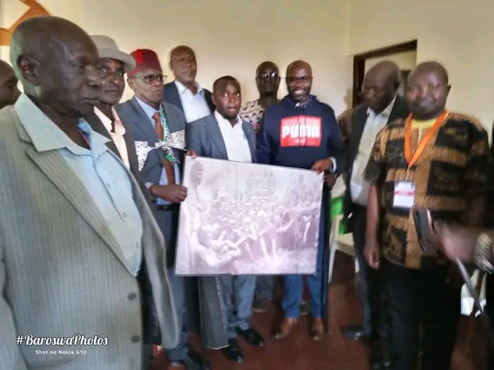Community presenting large historical photo